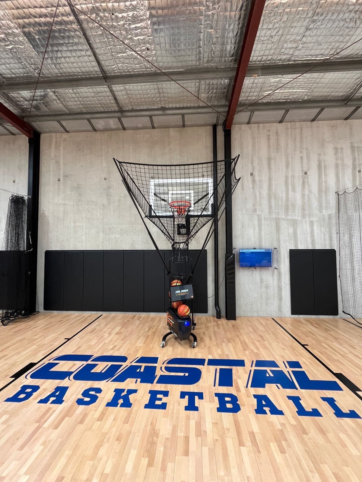 Dr. Dish CT+ shooting machine under the hoop on the Coastal Basketball court in Bunbury, WA