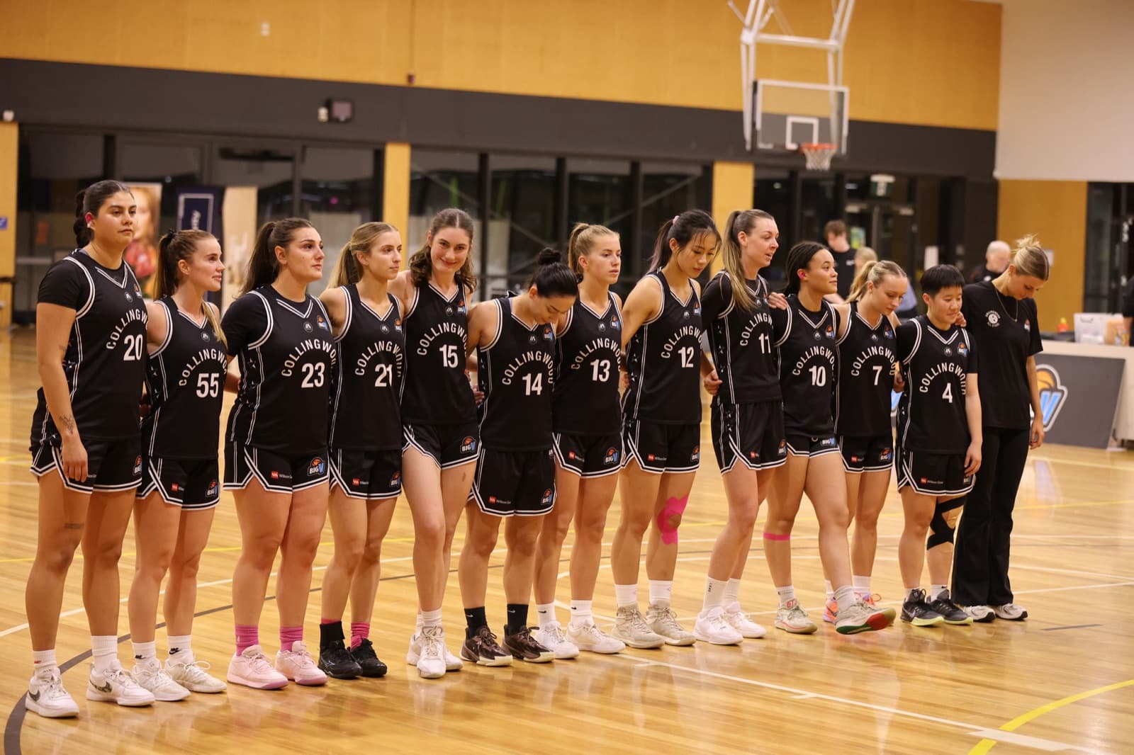 Collingwood All Stars women's Big V team lined up on court
