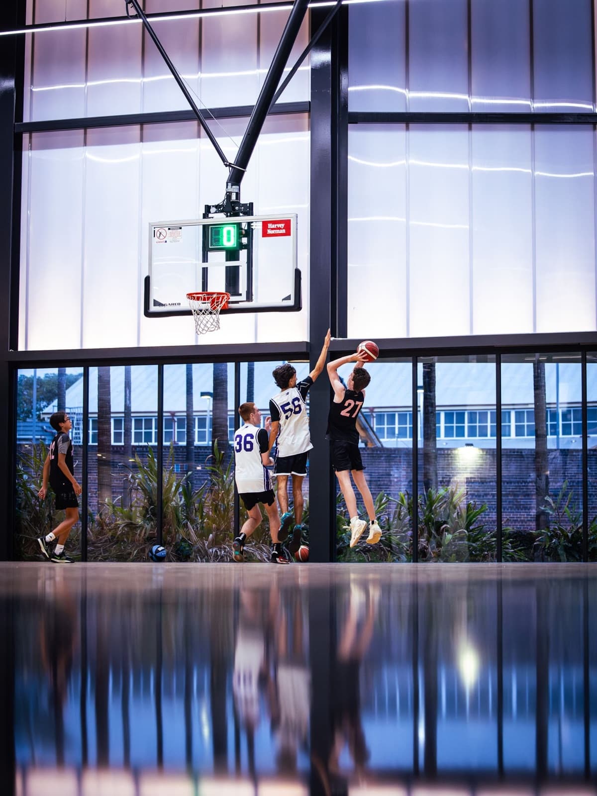 Players at the rim inside Hoops Capital East, Moore Park
