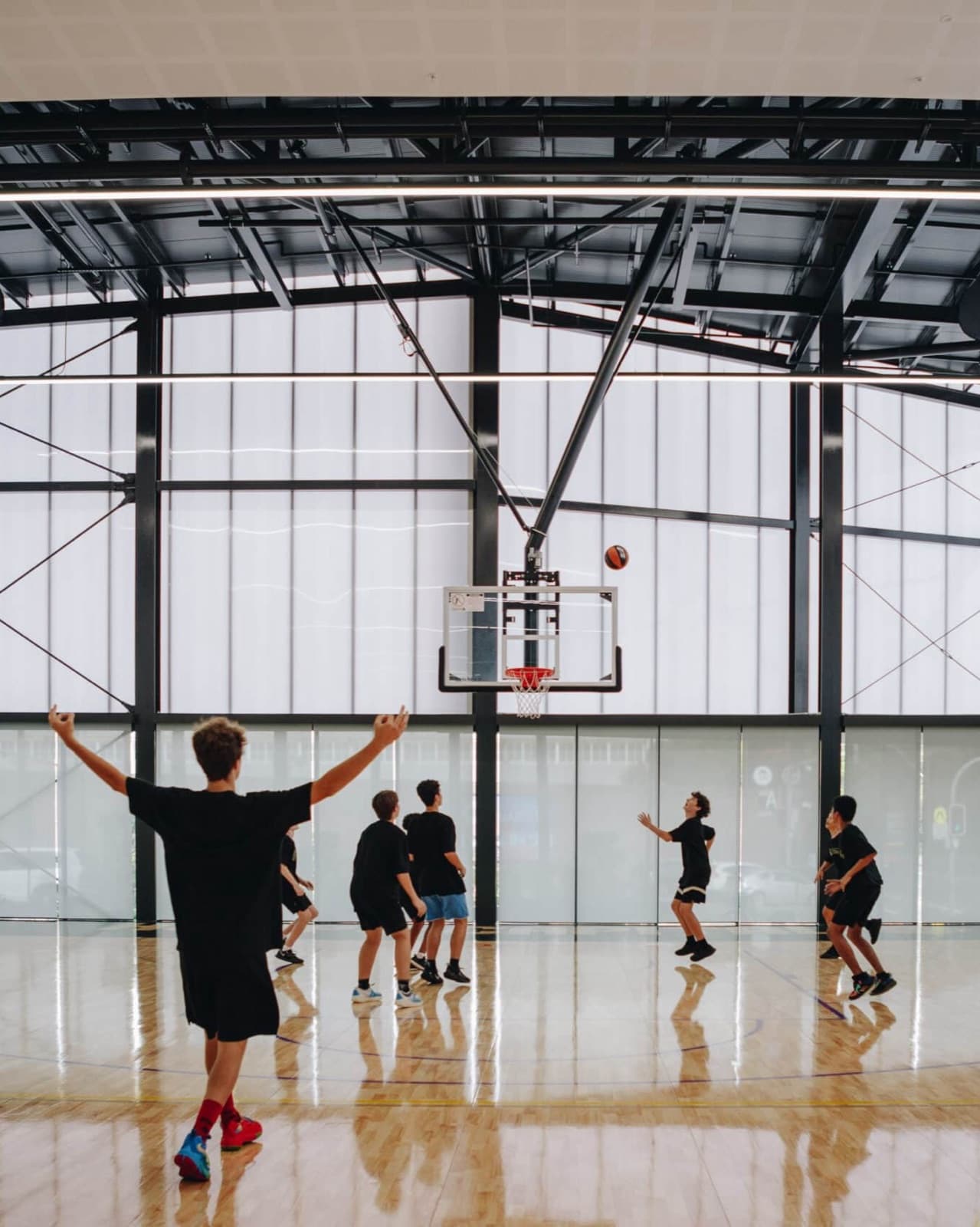 Players shooting on the court at Hoops Capital East, Moore Park, the Sydney Kings' facility run by Hoops Capital