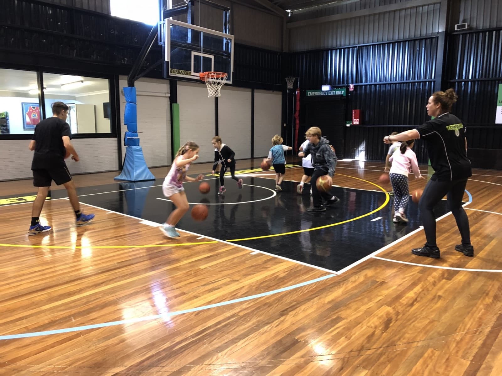 Coach running a junior training session at Taree Basketball