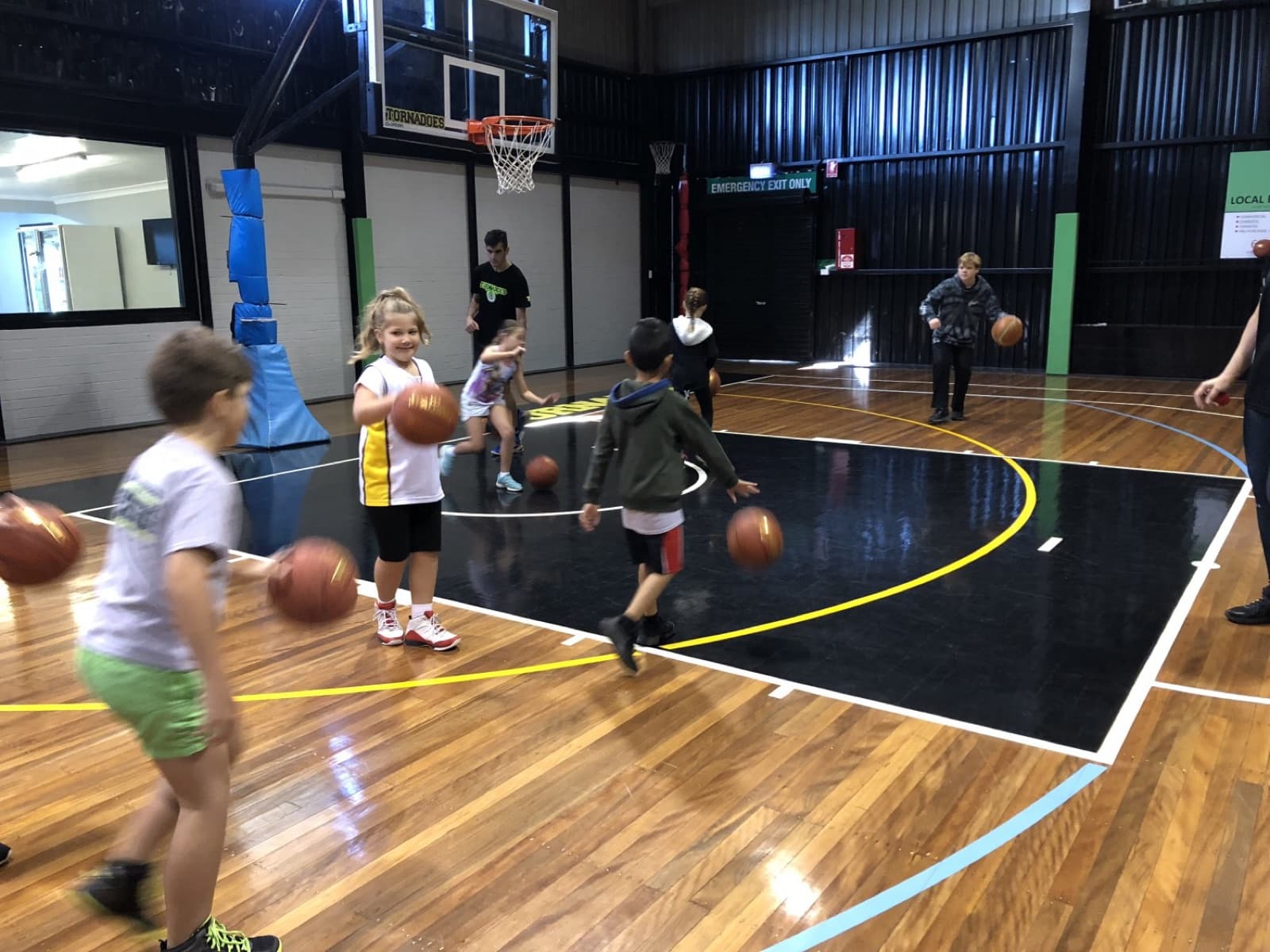 Young players doing dribbling drills at Taree Basketball